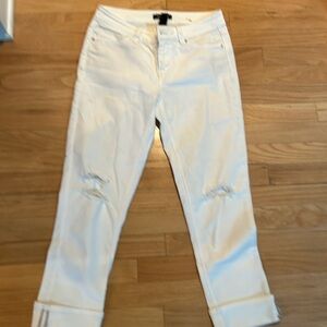 Distressed white denim slim crop jeans